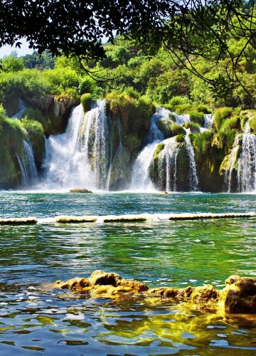 Waterfalls framed by foliage in Krka National Park in Croatia